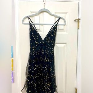 Lulus black and gold star tulle overlay babydoll mini dress